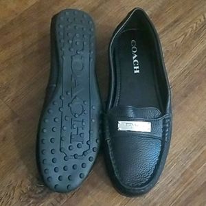 Black leather Coach loafers